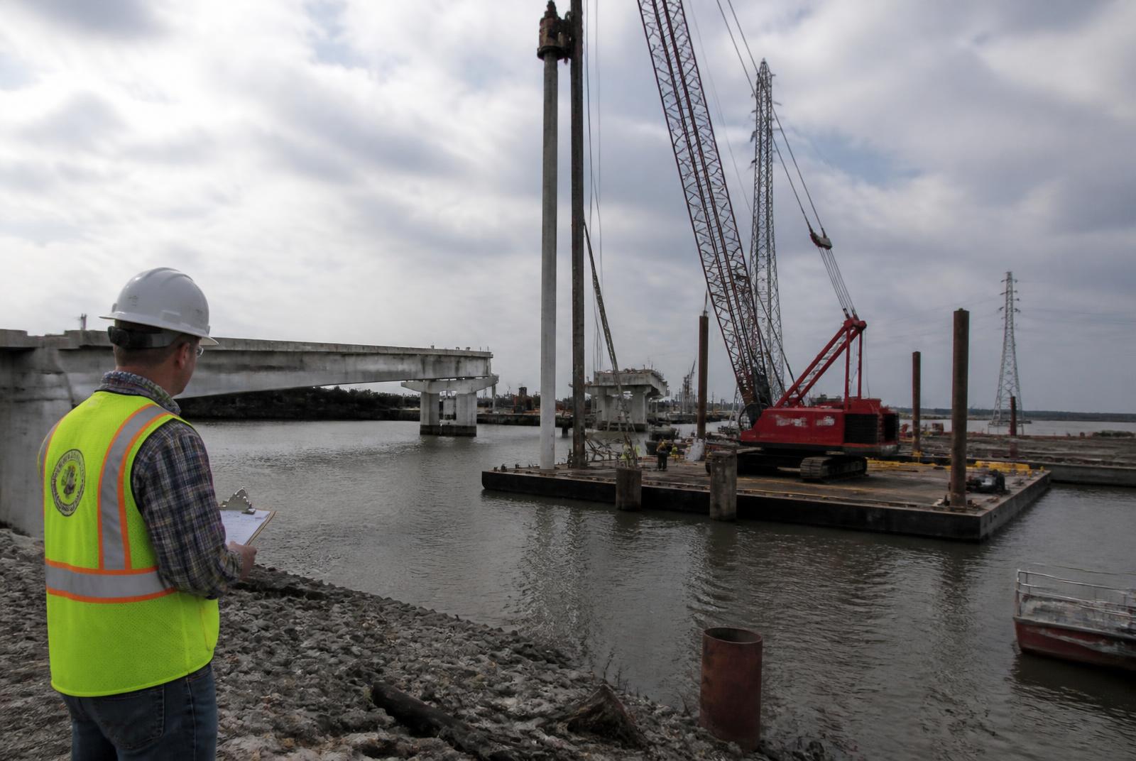 Consultant reviewing concrete placement at a waterfront construction site